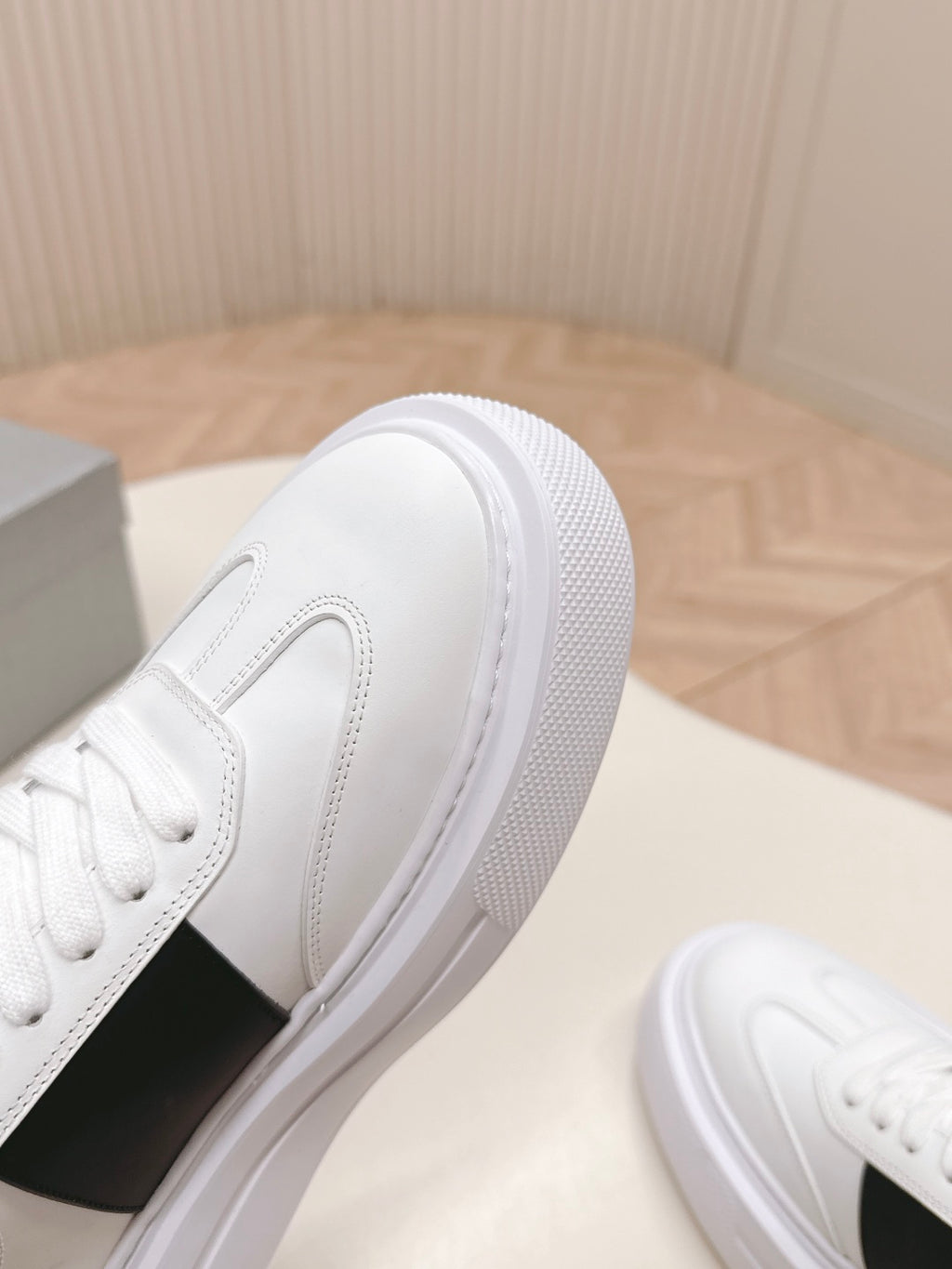 Prada unisex white sneakers with textured sidewall and black side panel detail