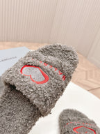 Balenciaga fuzzy slide sandal, grey close-up with red heart embroidery on strap