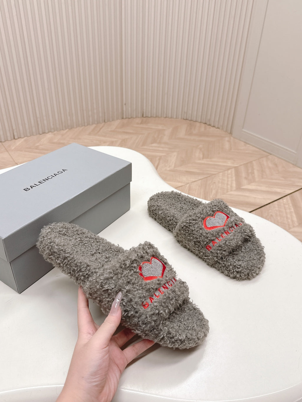 Balenciaga fuzzy slide sandals, grey plush with red heart stitching, side view