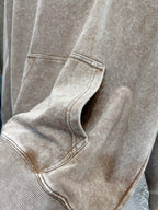 Beige FENDI hoodie kangaroo pocket seam and stitched edge detail.