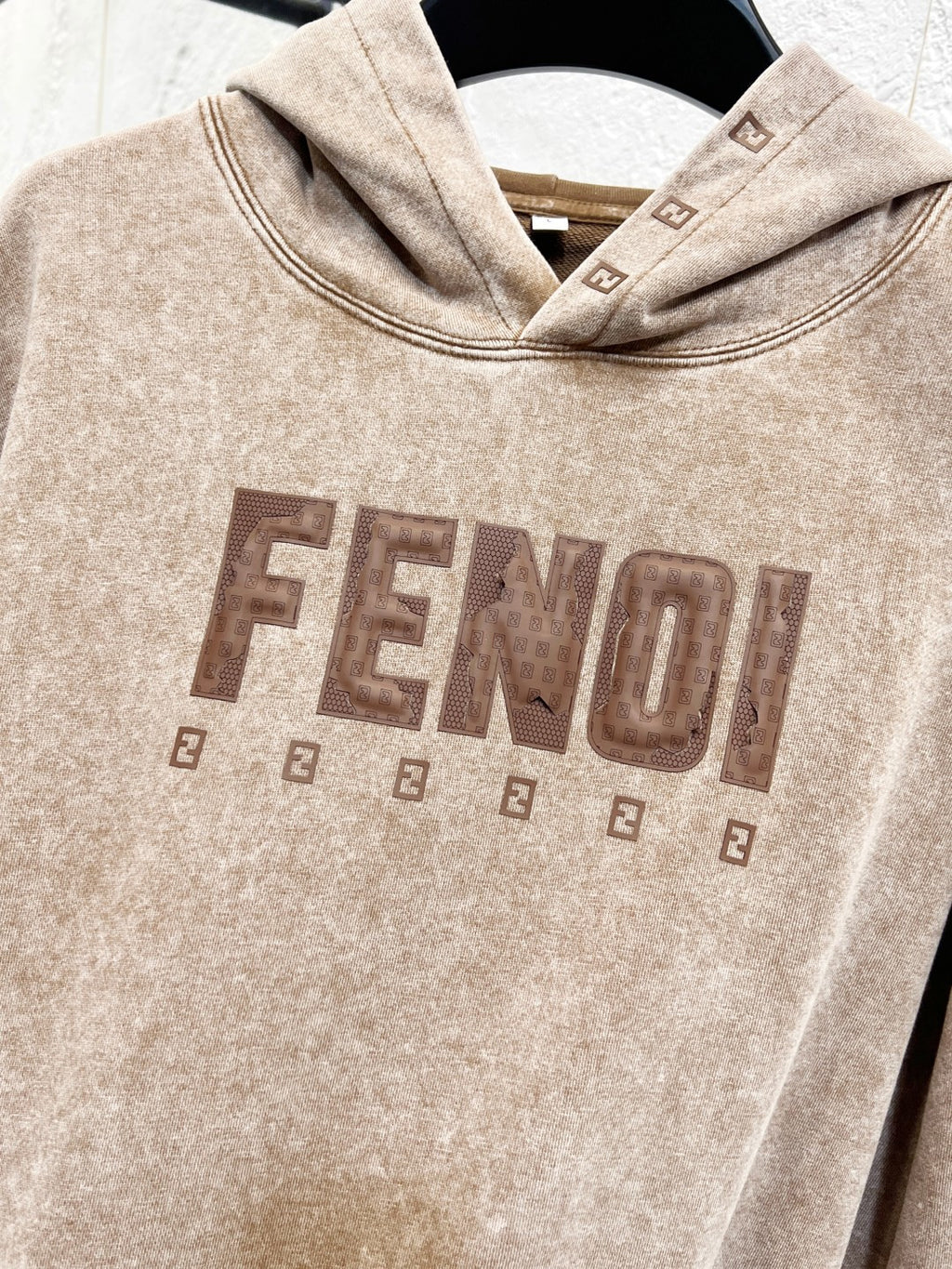 Beige FENDI hoodie front logo graphic centered on chest area.