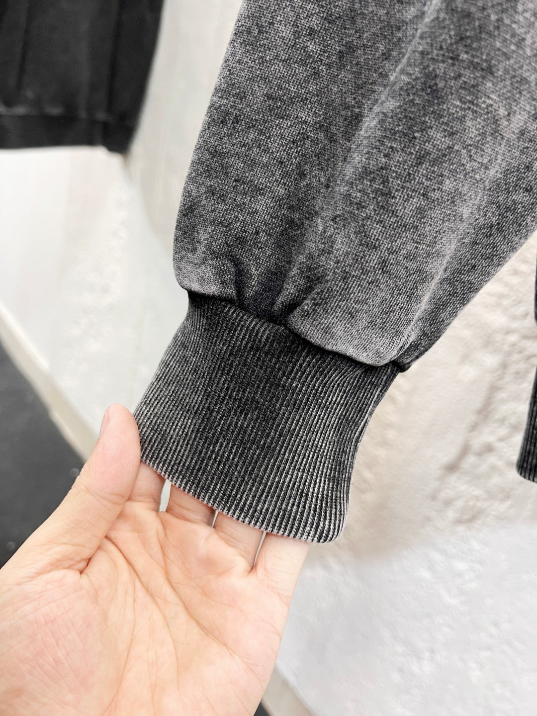 Heather gray hoodie cuff ribbing and knit hem edge
