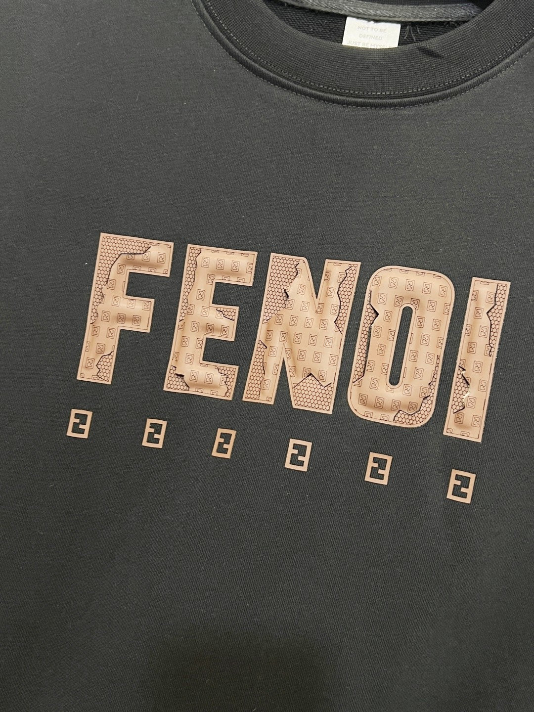 Black sweatshirt with large FENDI wordmark and small repeating E emblems