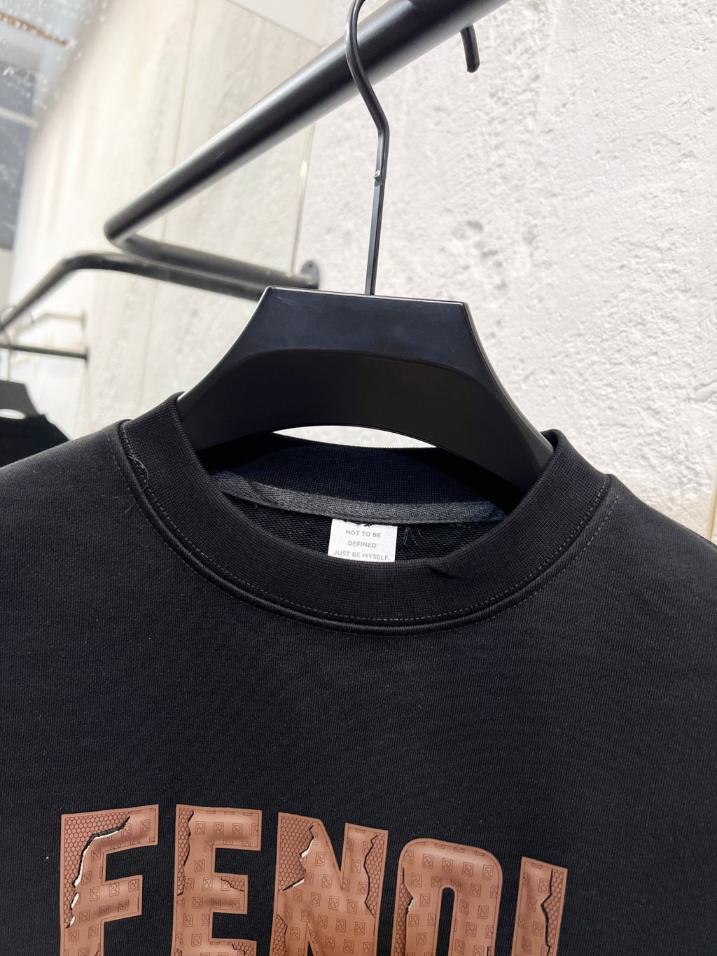 Black crewneck sweatshirt with FENDI logo and ribbed neckline