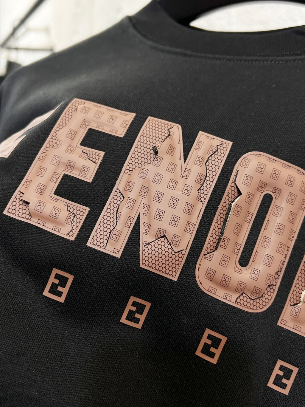 Black sweatshirt with FENDI wordmark and patterned logo letters