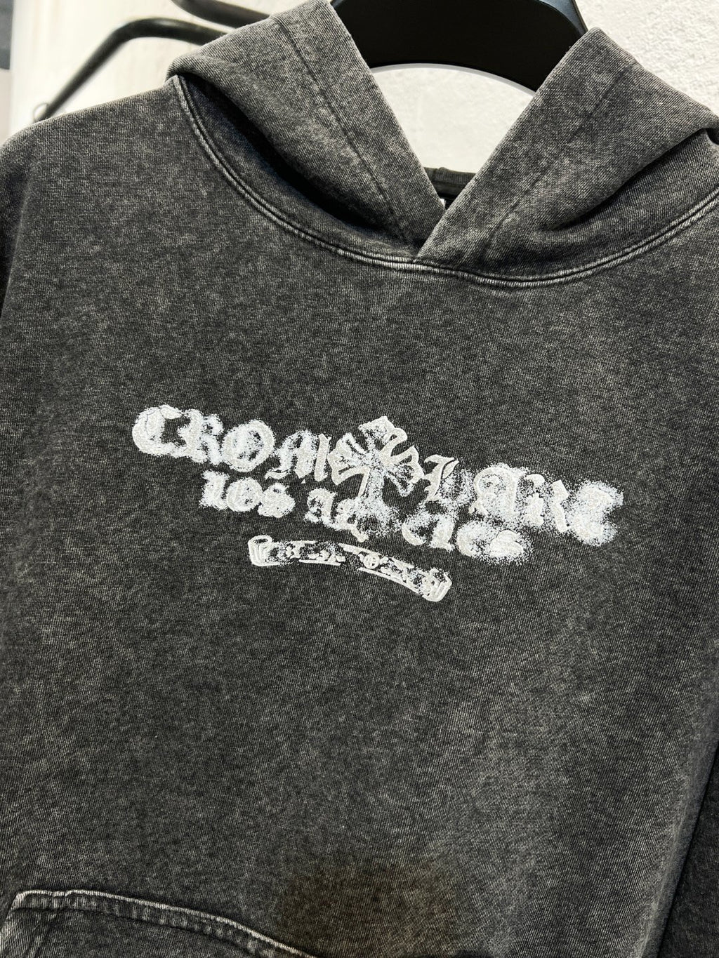 Heather gray hoodie sweatshirt with white chest logo and hood neckline