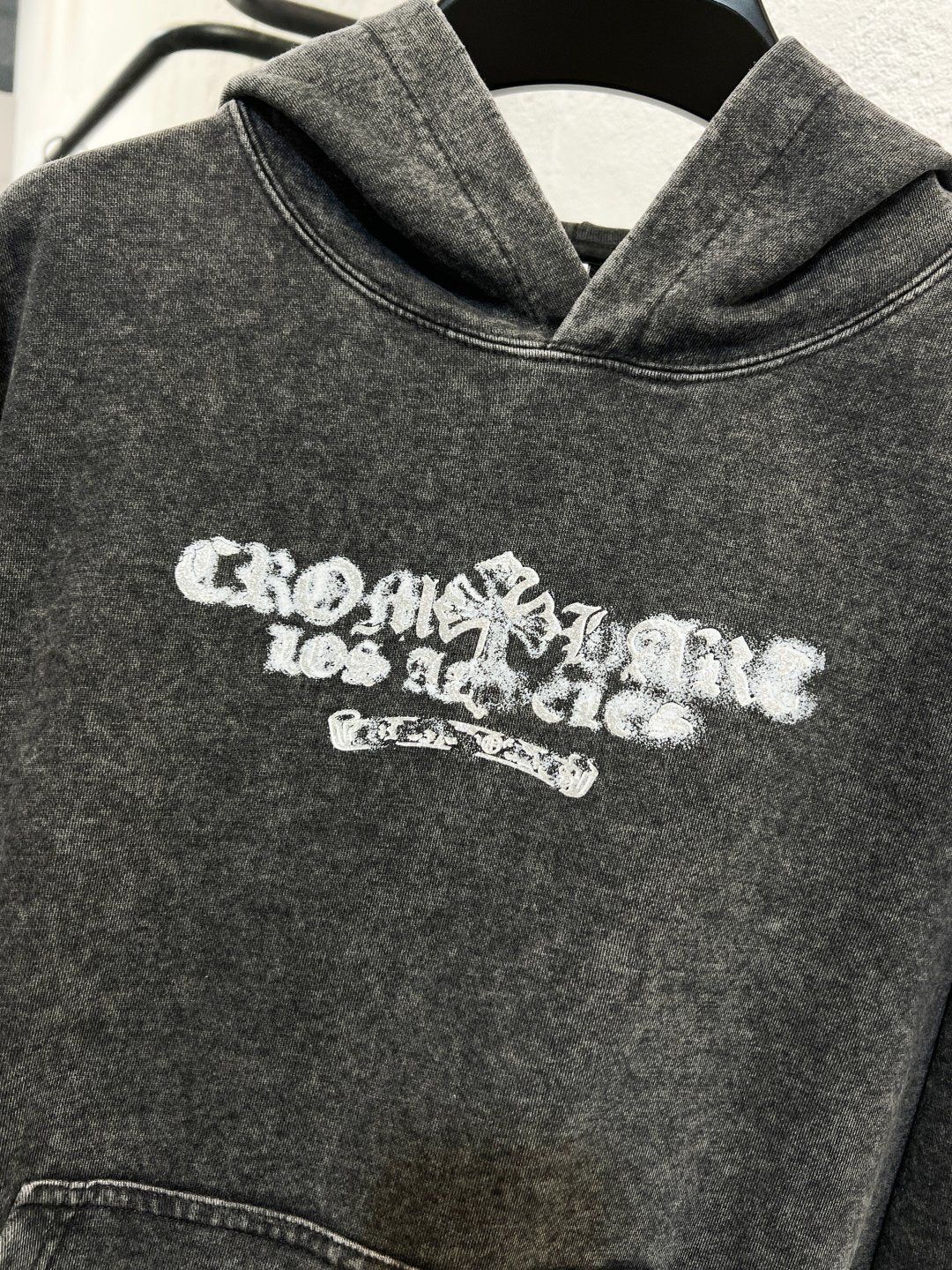 Heather gray hoodie sweatshirt with white chest logo and hood neckline