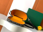 Goyard patterned crossbody bag with orange fabric-lined interior and zipper