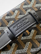 Goyard logo leather patch on patterned bag with stitched black trim