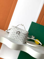 Goyard patterned mini bag with short top handle and crossbody strap