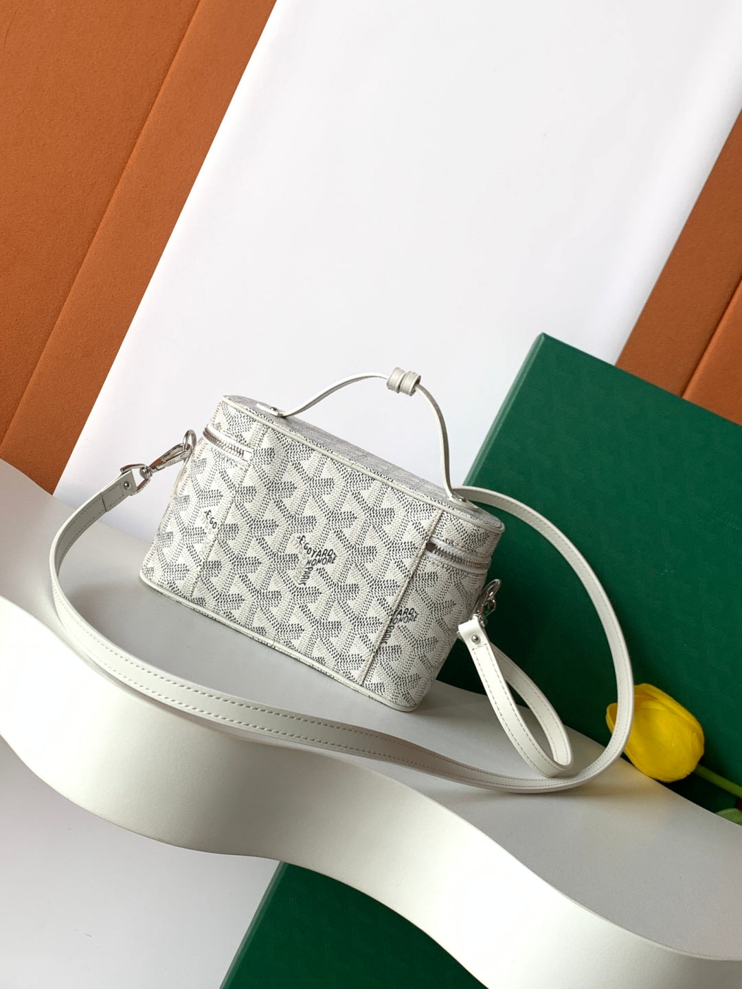 Goyard patterned mini bag with top handle and crossbody strap, front view