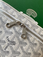 Goyard patterned mini bag closeup of zipper pull and front logo stamp