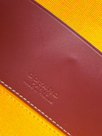 Goyard leather corner close-up with embossed logo and contrast stitching