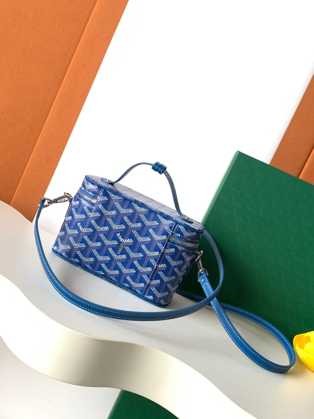 Goyard blue patterned crossbody bag with long strap and zip closure