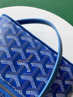 Close-up of Goyard blue patterned fabric bag with zipper track and stitching