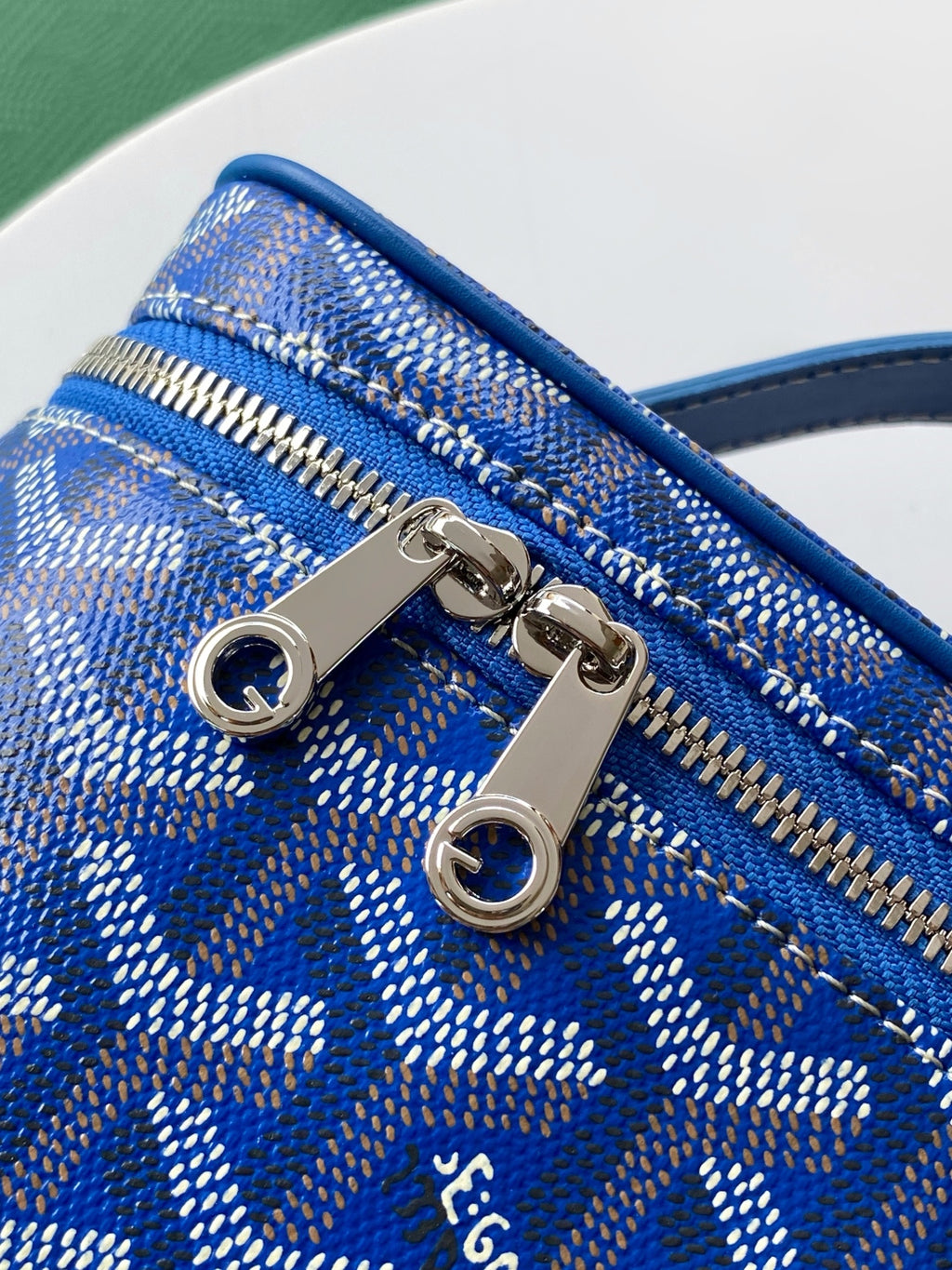 Goyard blue patterned mini bag with two metal zipper pulls