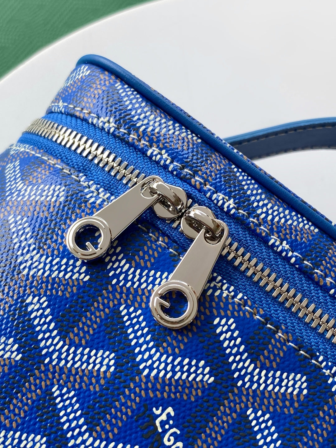 Goyard blue patterned mini bag with two metal zipper pulls