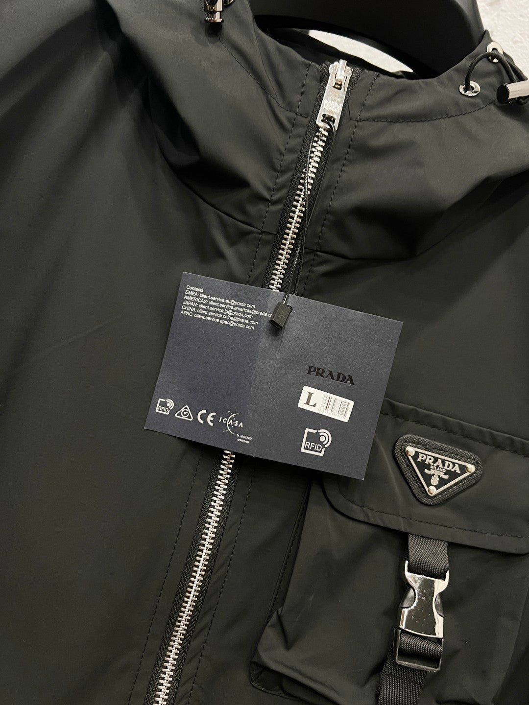 Prada black hooded jacket with silver zipper and PRADA logo patch