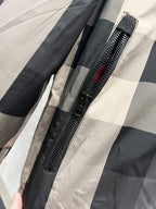 Burberry jacket close-up of front zipper on dark gray and check pattern