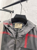Burberry hooded jacket collar close-up with inner label and black zipper pull