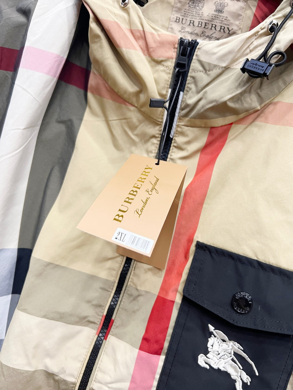 Burberry check hooded jacket with front zipper, logo tag, and horses emblem