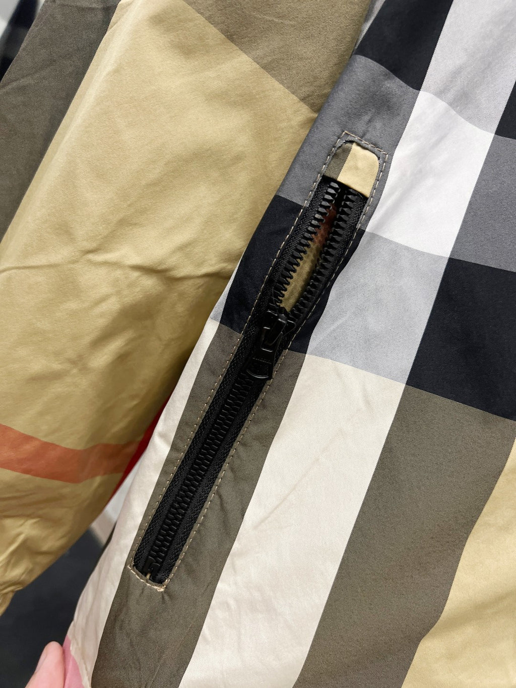 Burberry check hooded jacket front zipper detail on plaid fabric