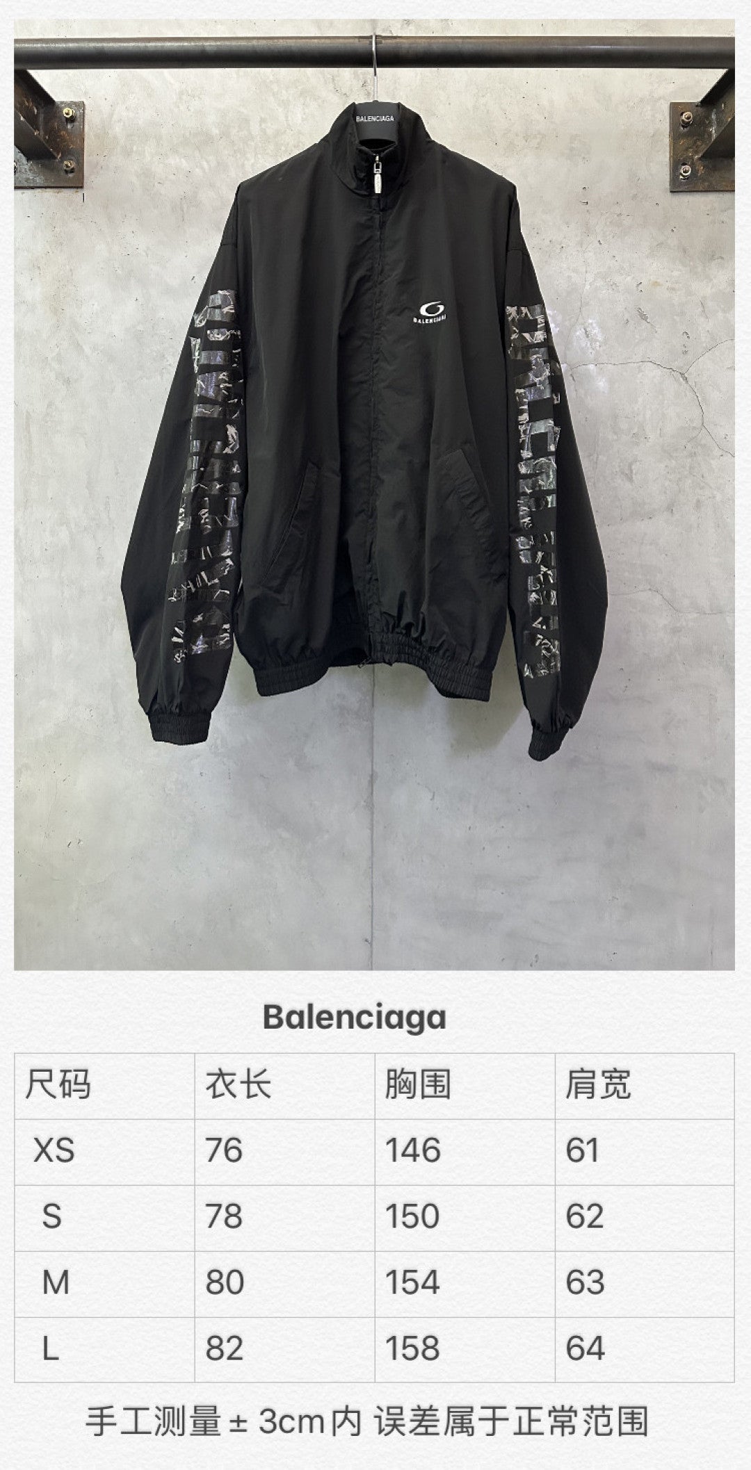 Long black bomber jacket with printed sleeve panels and front zip