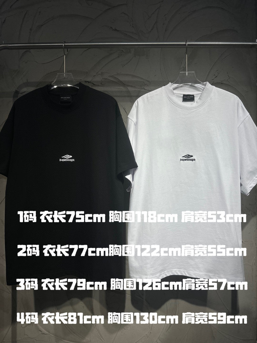 Black and white T-shirts with small chest logos and size chart print