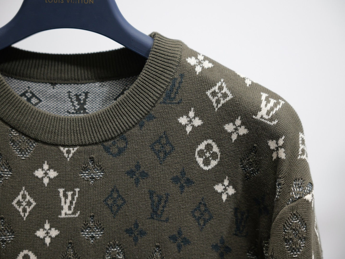 Louis Vuitton monogram long-sleeve sweatshirt close-up of crew neck and sleeve, dark olive