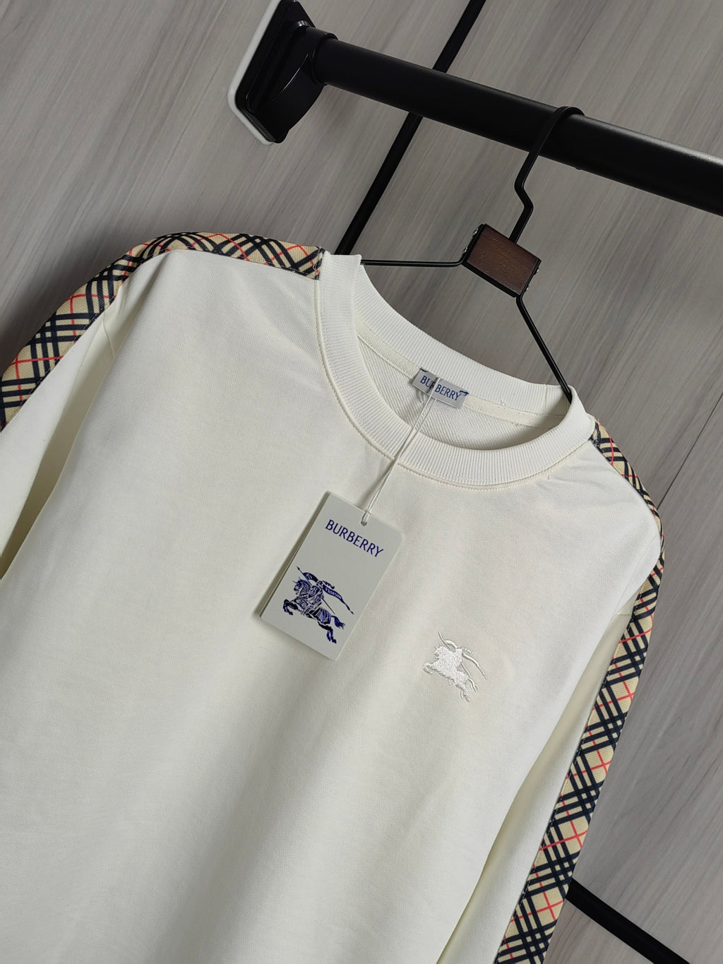 Burberry kids crewneck sweatshirt, cream color with polo player graphic on chest.