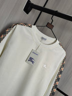 Burberry kids crewneck sweatshirt, cream color with polo player graphic on chest.
