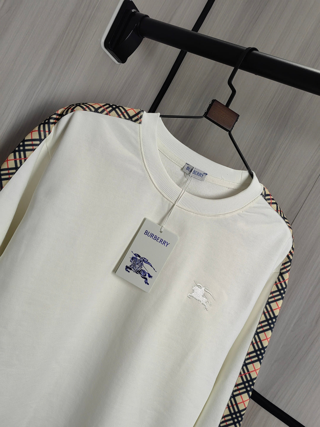 Burberry kids crewneck sweatshirt, cream color with polo player graphic on chest.