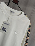 Burberry kids crewneck sweatshirt close-up with crew neck, chest graphics, and tag.