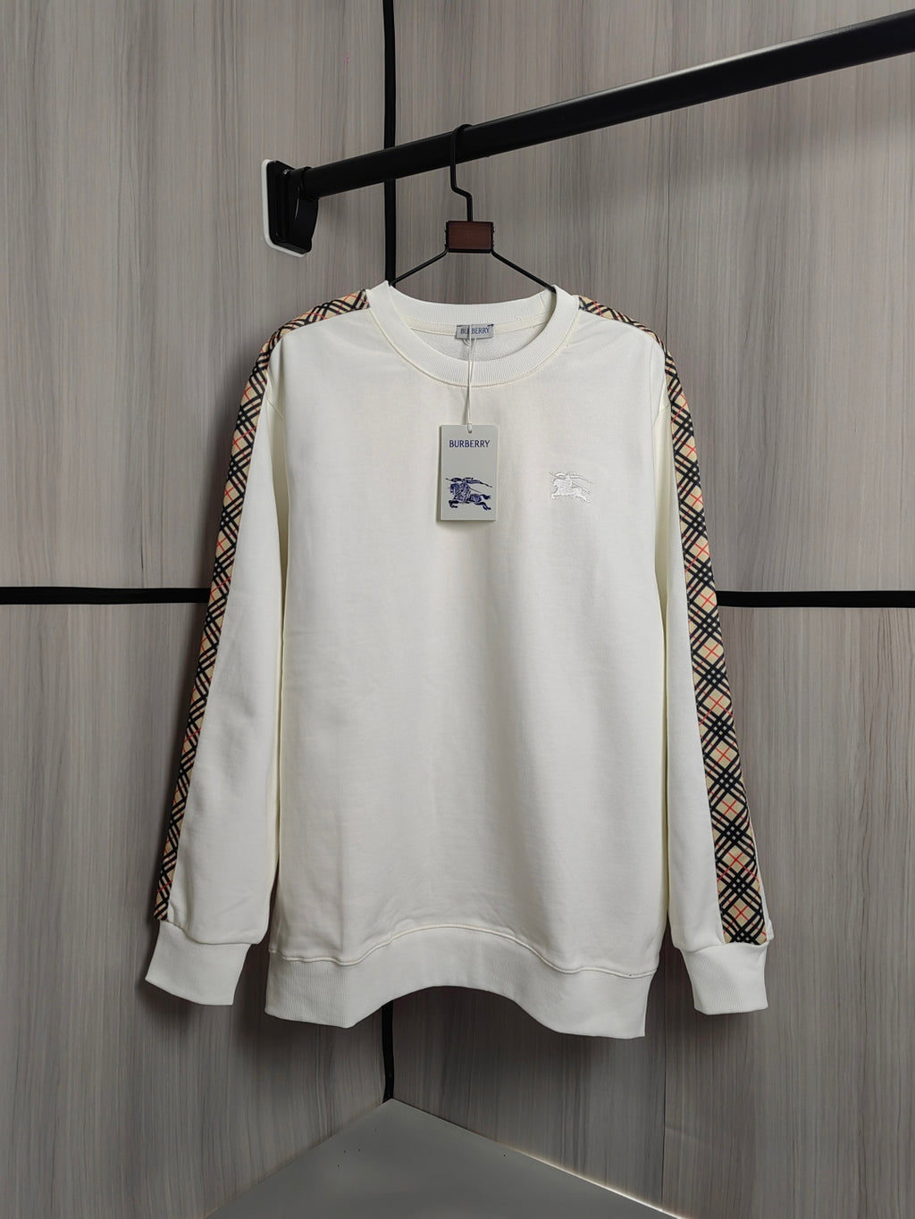 Burberry kids crewneck sweatshirt, cream with check trim sleeves and small chest graphics.