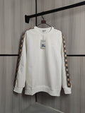Burberry kids crewneck sweatshirt, cream with check trim sleeves and small chest graphics.
