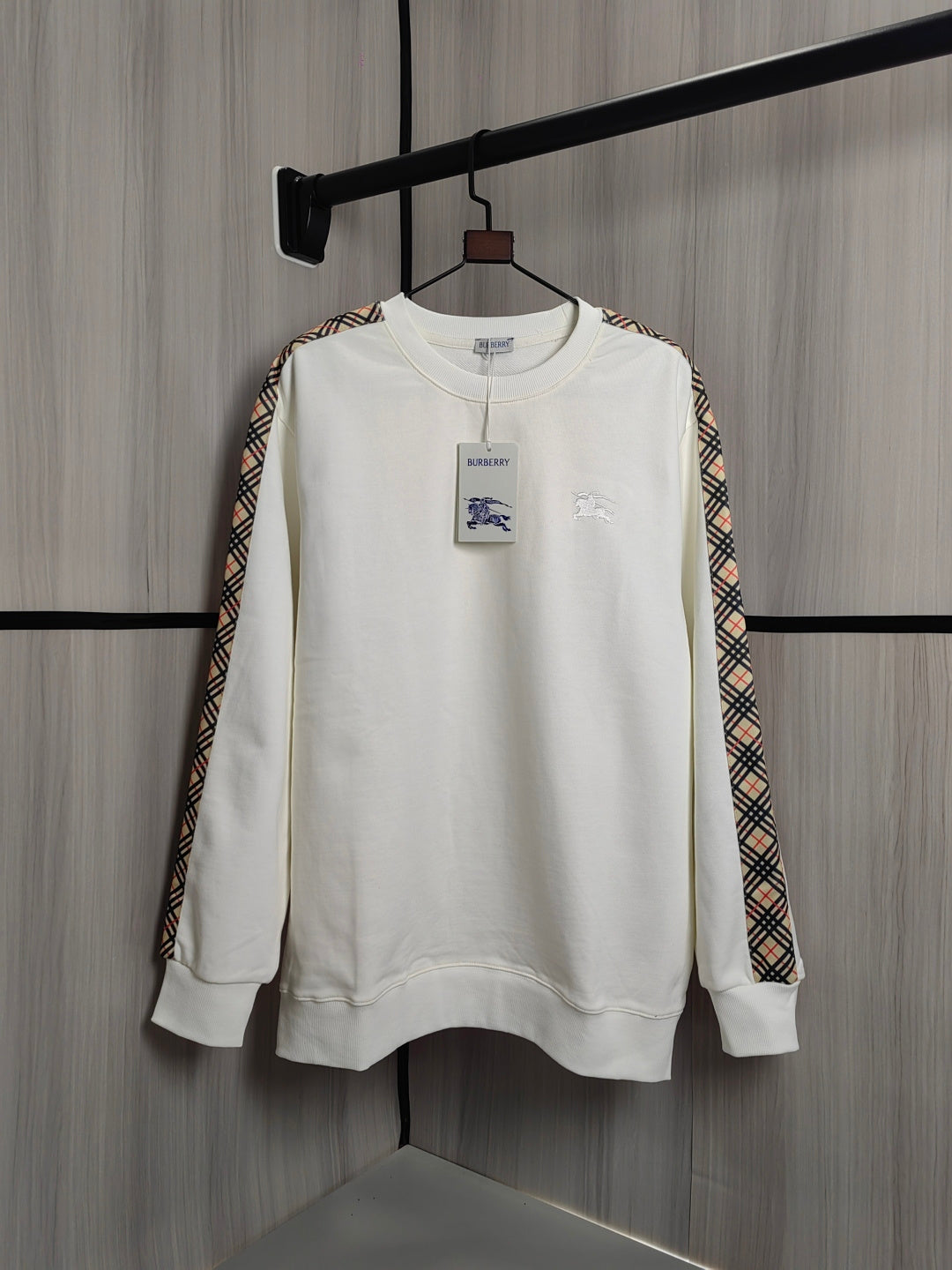 Burberry kids crewneck sweatshirt, cream with check trim sleeves and small chest graphics.