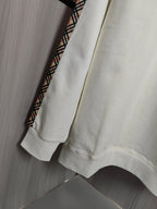 Burberry kids crewneck sweatshirt back view in cream with check-trim accents at side.