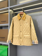 Light quilted jacket with button front, stand collar, and plaid cuff trim