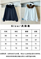 Size chart page with hooded zip-up jackets in dark and white