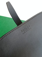 Goyard leather belt bag with stitched edge and embossed brand text