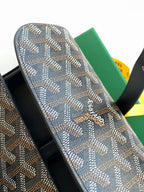 Goyard patterned belt bag with black leather side and brand logo stamp