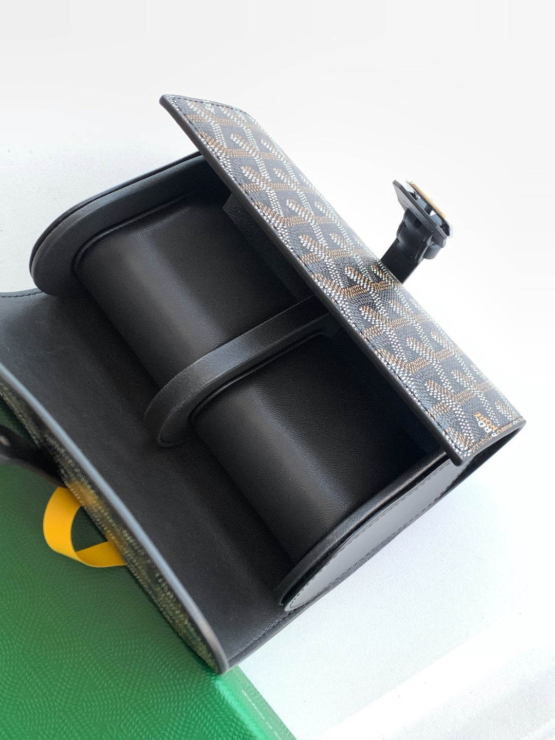 Goyard belt bag open view with black interior and patterned exterior