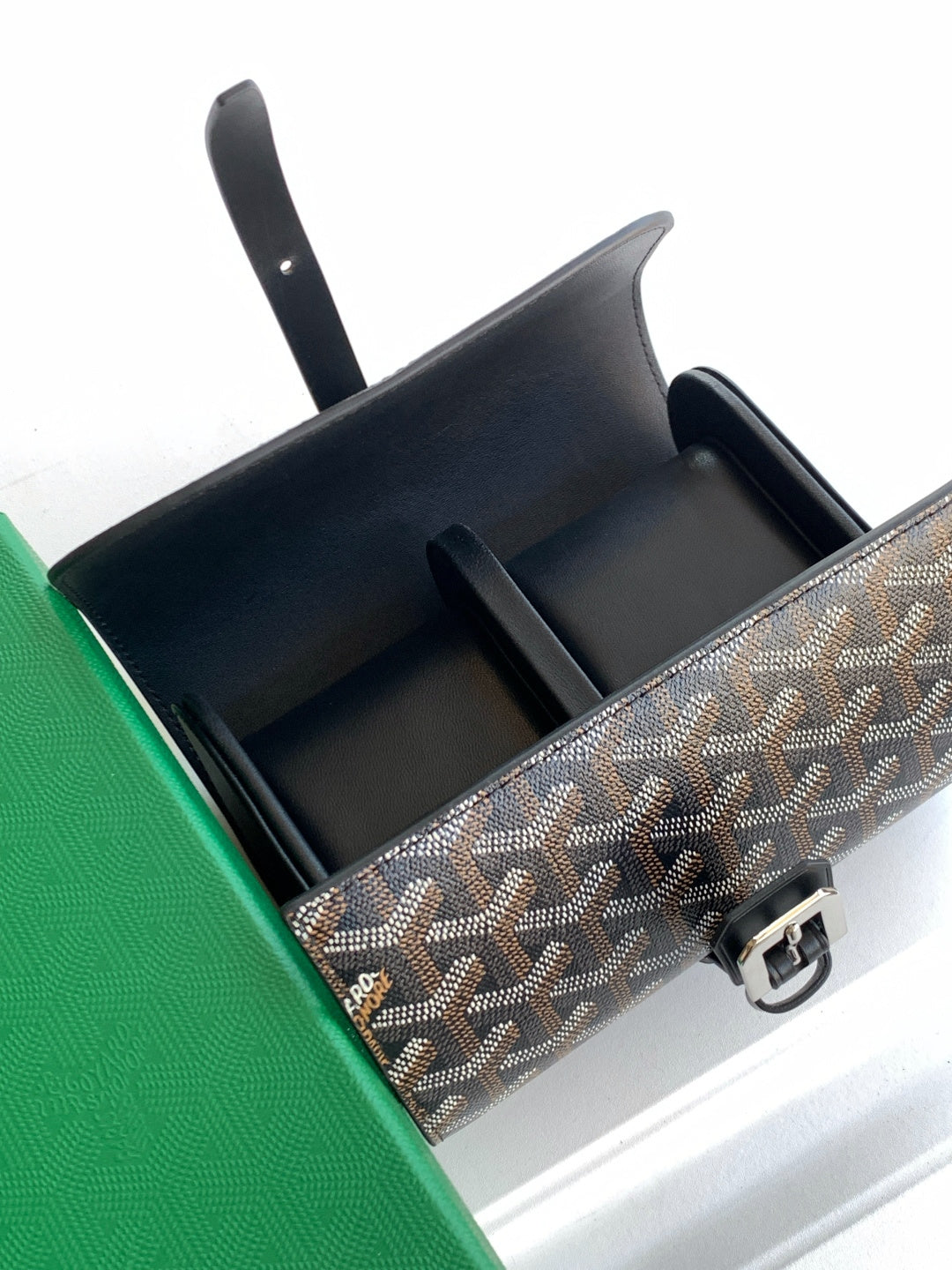 Goyard belt bag open top showing black interior compartments