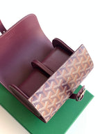 Goyard monogram bag open with burgundy leather interior dividers