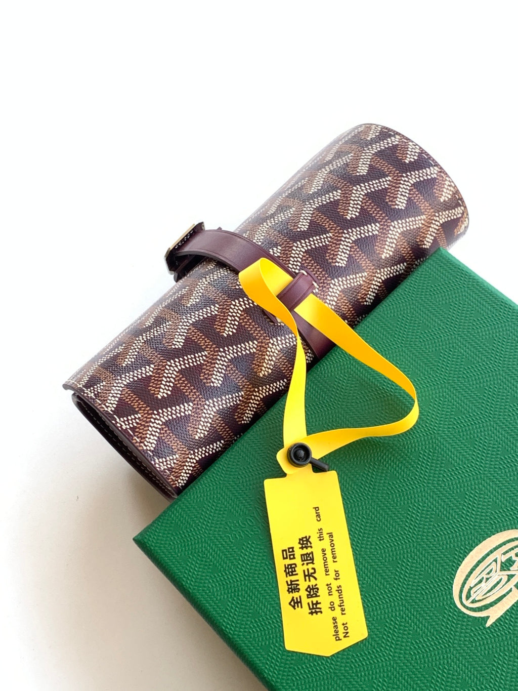 Goyard monogram roll-top bag with burgundy strap and yellow tie