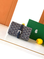 Goyard monogram crossbody bag with navy leather flap and buckle strap