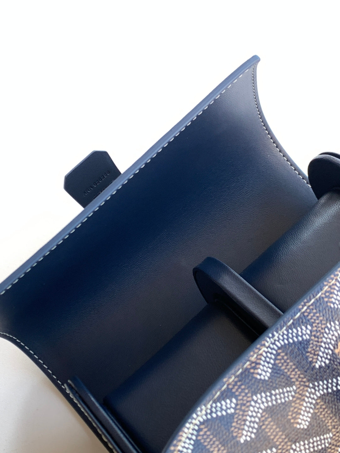 Goyard monogram bag interior pocket with dark blue leather lining