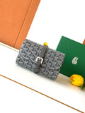 Goyard patterned bag with gray leather flap and front buckle closure