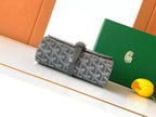 Goyard patterned crossbody bag with gray leather buckle and top flap