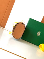 Goyard small pouch bag with tan leather edge and yellow pull cord